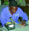 Factory worker assembling patch antenna